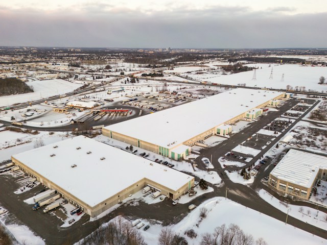 Aerial view of a snow-covered commercial distribution facility